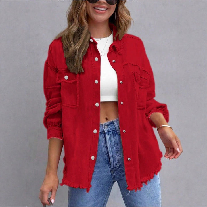 Women's oversized denim shirt jacket with fringe trim, flap pockets, and snap front Mune Fashion
