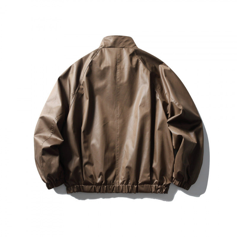 Men's short cut faux leather bomber jacket with stand-up collar, raglan sleeves, and elastic hem Mune Fashion