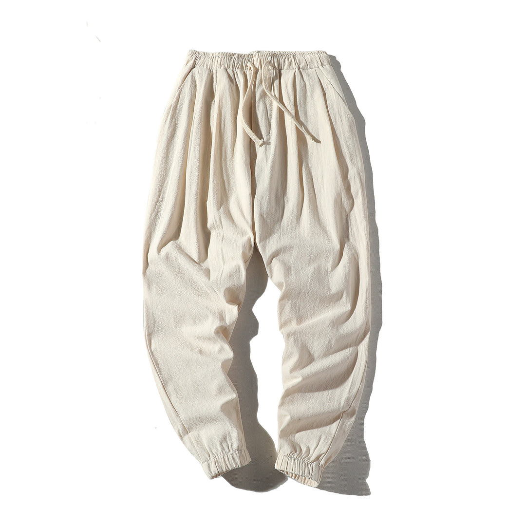 Men's loose joggers with elastic waistband, drawstring, side pockets, and elastic cuffs Mune Fashion