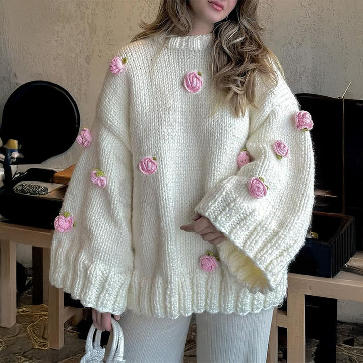 Women's oversized knit sweater with 3D floral appliqués and wide trumpet sleeves Mune Fashion