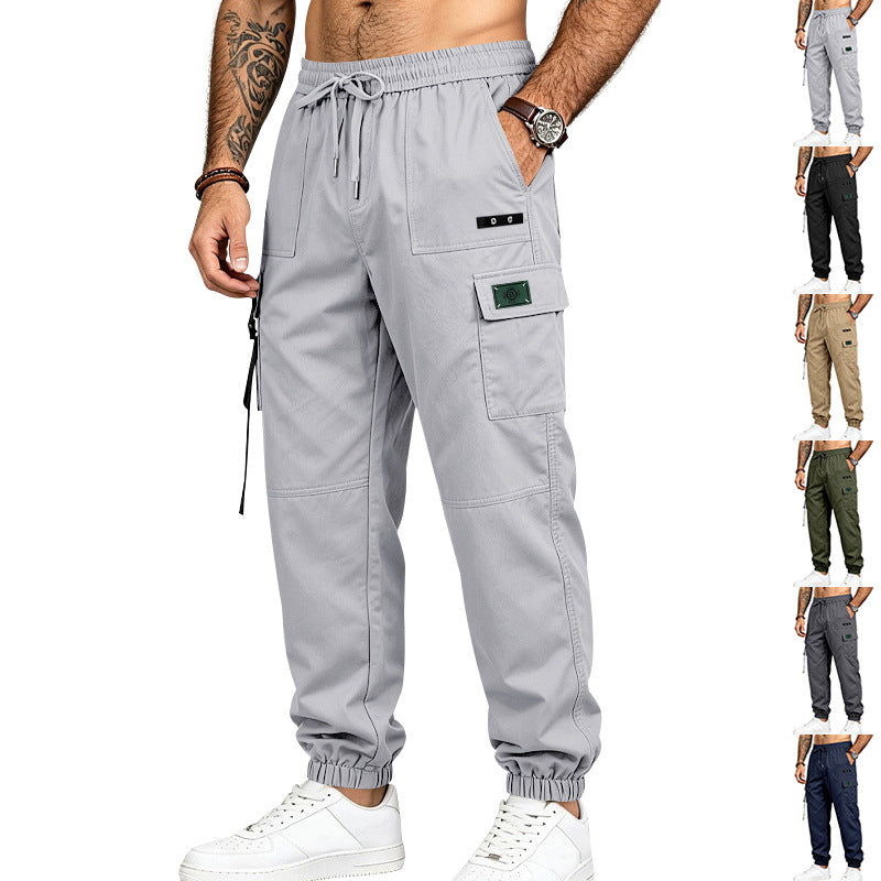 Men's utility cargo pants in jogger style with elastic waistband, multiple pockets and leg straps Mune Fashion