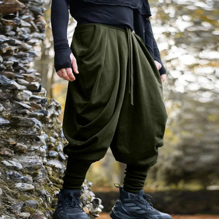 Men's avant-garde harem pants with wrap front, elastic waistband, and slim ankles Mune Fashion