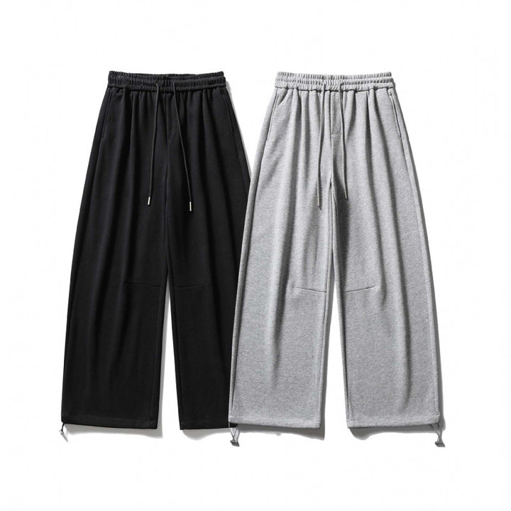 Unisex Wide Sweatpants with drawstring waistband, cord drawstring, and adjustable leg straps Mune Fashion