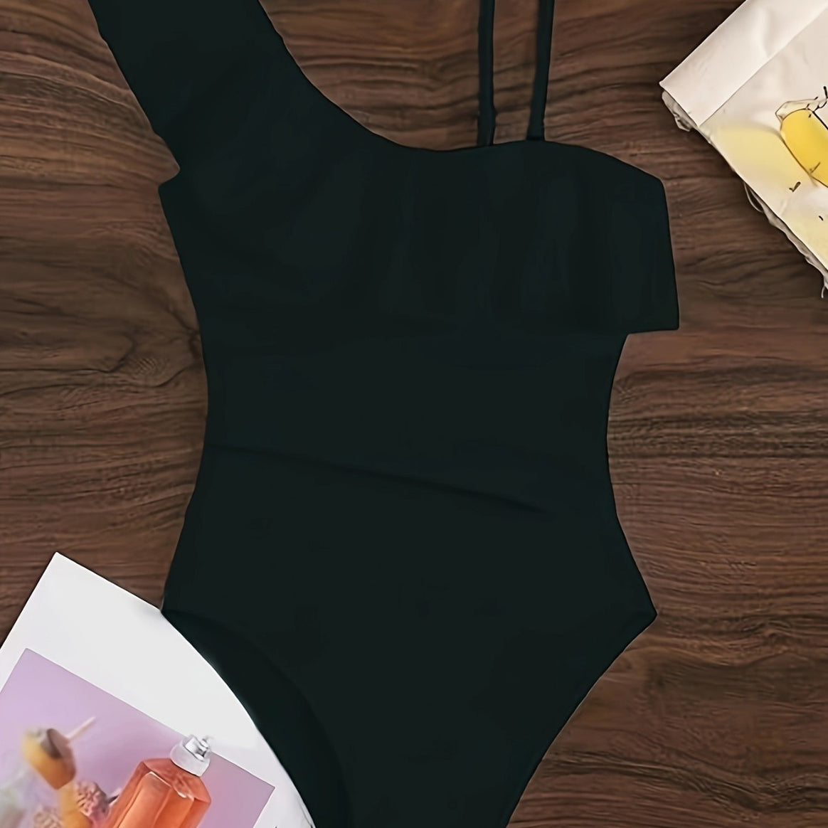 Women's one-piece swimsuit with asymmetric ruffle design and elegant cut-out details Mune Fashion
