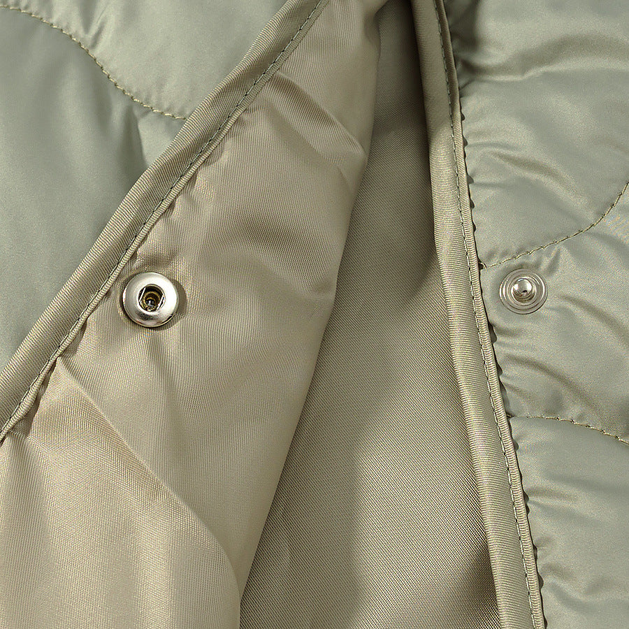 Women's lightweight quilted jacket with round neckline, quilted waves, and press buttons Mune Fashion