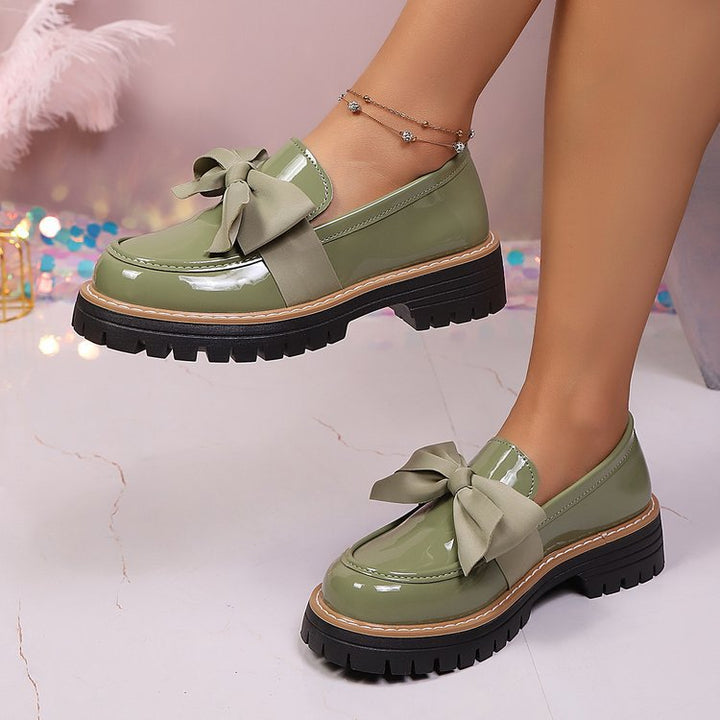 Ladies patent look loafer with massive profile sole and large fabric bow Mune Fashion