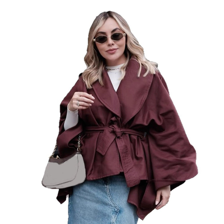 Women's short trench-style jacket with belted waist, oversized sleeves, and boxy cropped silhouette Mune Fashion