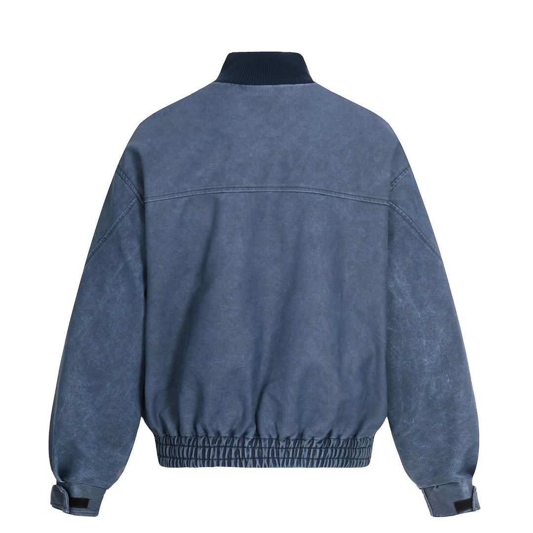 Men's short boxy blouson made of corduroy fabric with high ribbed collar and elastic hem.