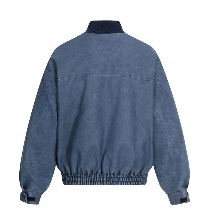 Men's short boxy blouson made of corduroy fabric with high ribbed collar and elastic hem.