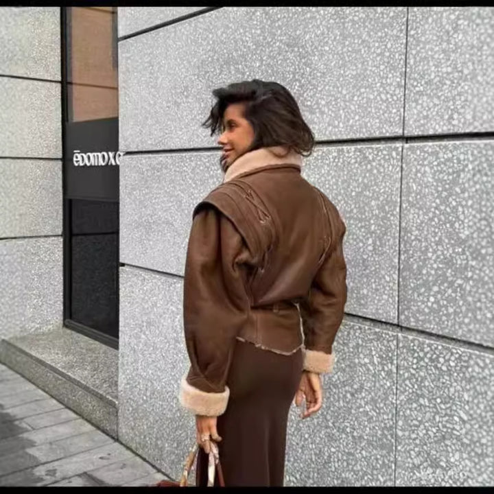 Women's tailored faux leather jacket with Sherpa lining, wrap belt, and side lacing details Mune Fashion