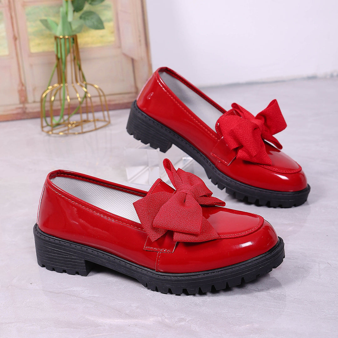 Women's patent leather platform loafers with patterned rubber sole and decorative bow Mune Fashion
