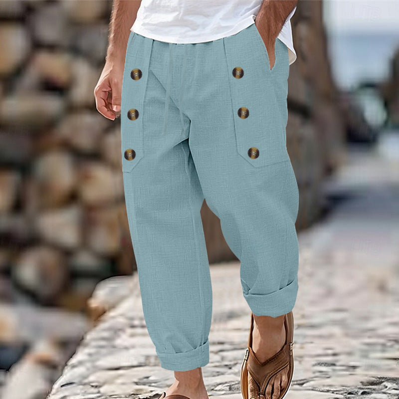 Men's loose linen trousers with decorative button stripes, rolled ankle cuffs, and side pockets Mune Fashion