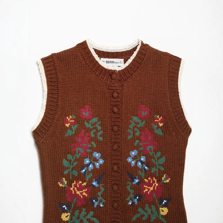 Women's sleeveless knitted vest with floral intarsias, button placket and crocheted hem Mune Fashion