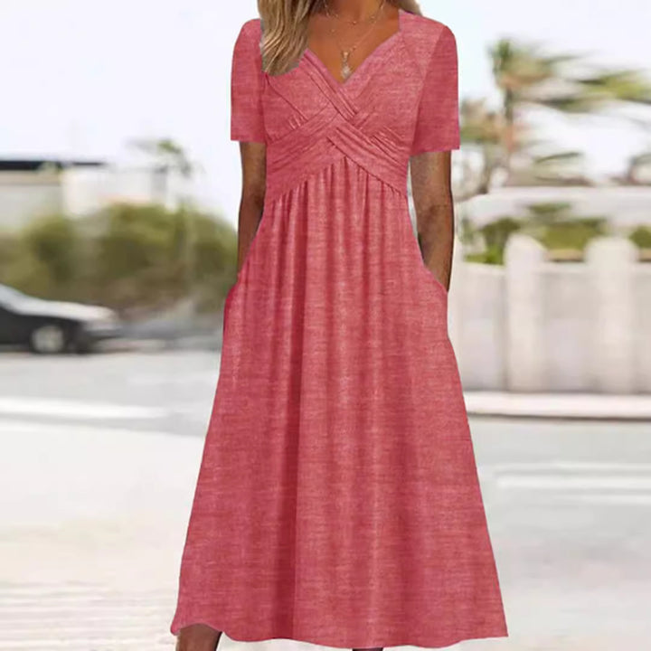 Women's flowing maxi dress with crossed yoke V-neck short sleeves and side pockets Mune Fashion