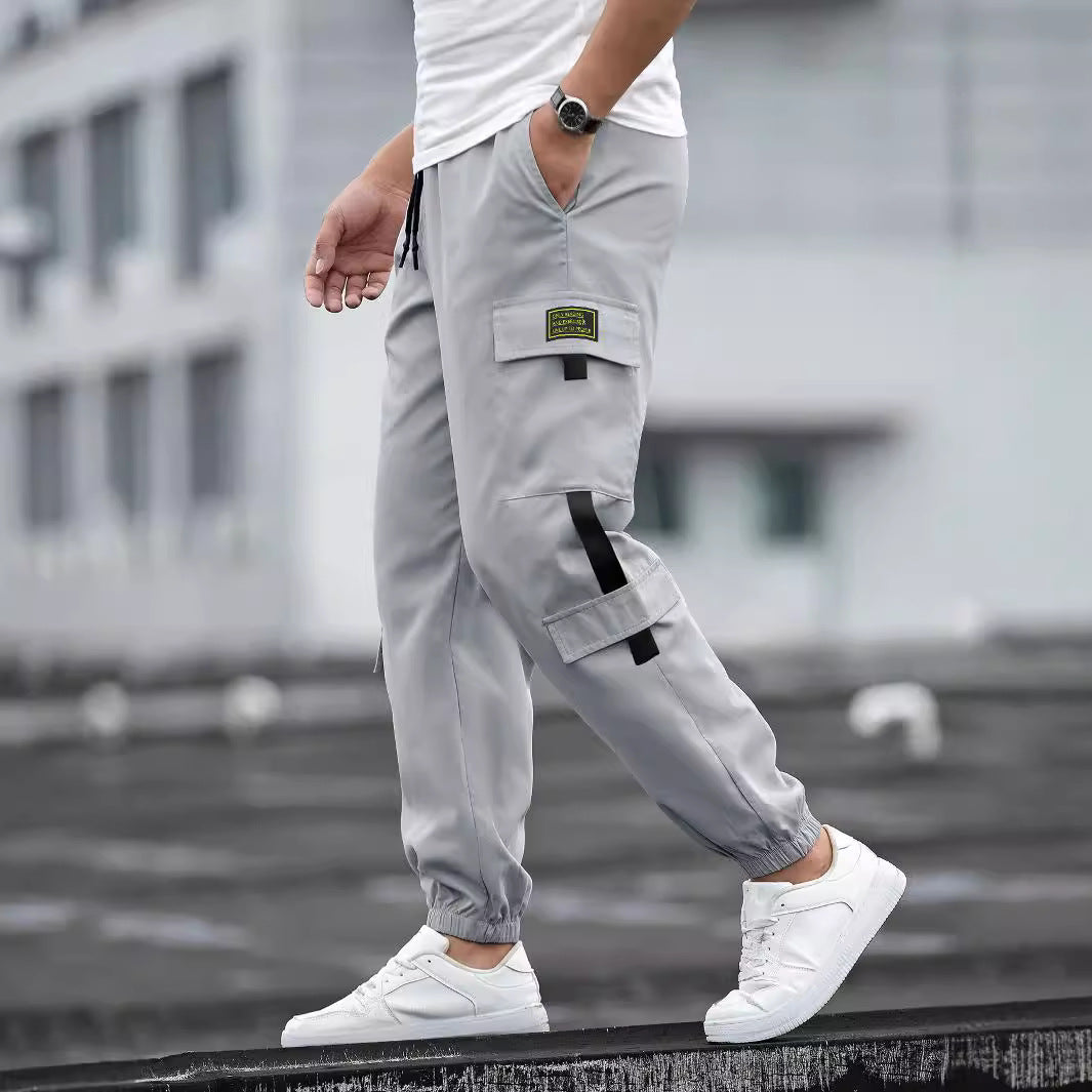 Men's fashionable cargo jogger pants with elastic waistband, drawstring, and multiple security and flap pockets Mune Fashion