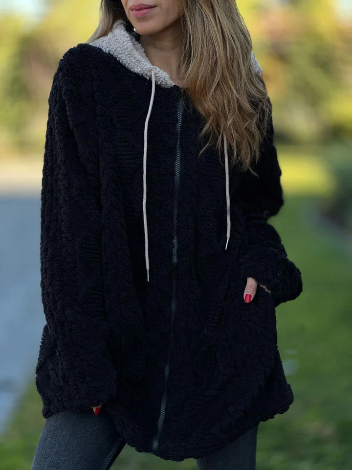 Women's oversized teddy coat jacket with contrasting hood, zipper, and side pockets Mune Fashion