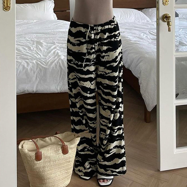Ladies wide pleated trousers with zebra pattern, elastic drawstring and flowing jersey feel Mune Fashion