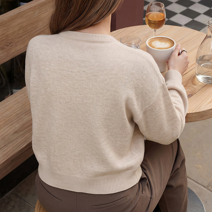 Women's fine knit cardigan with decorative knot closure and casual raglan silhouette Mune Fashion