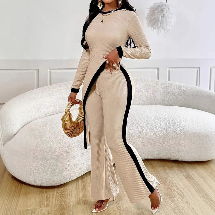 Women's elegant ribbed jumpsuit with asymmetrical wrap look, fitted cut-out, and contrasting side stripes Mune Fashion