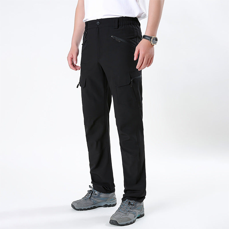 Men's nano technical trekking pants with elastic waistband, pre-shaped knees, and multiple cargo and zip pockets.