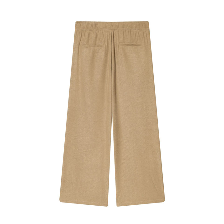 Women's loose high-waist pants with drawstring, decorative dividing seams, and flared leg Mune Fashion