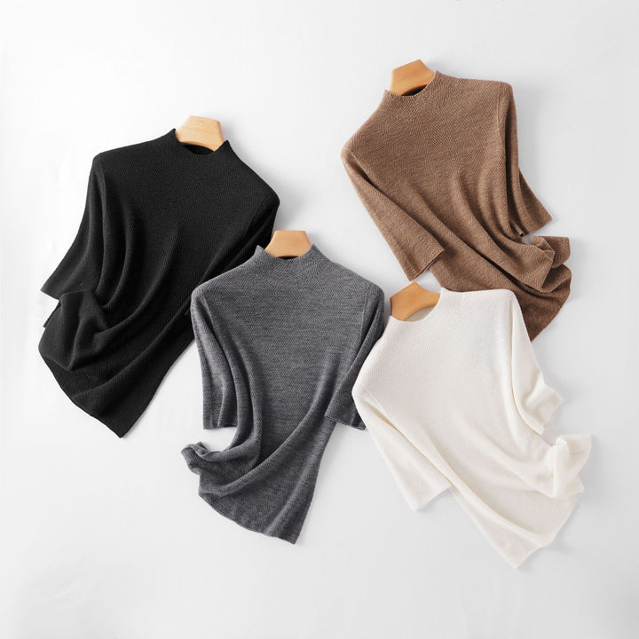 Women's fine-knit top with stand-up collar, elbow-length sleeves, and herringbone structure Mune Fashion