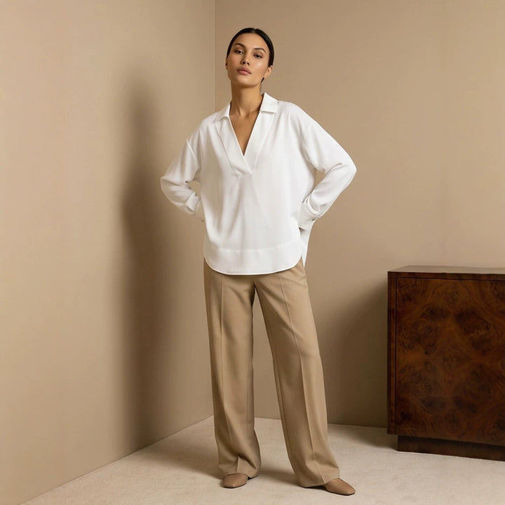 Women's loose-fitting tunic blouse with V-neck, shirt collar, and extended back hem Mune Fashion