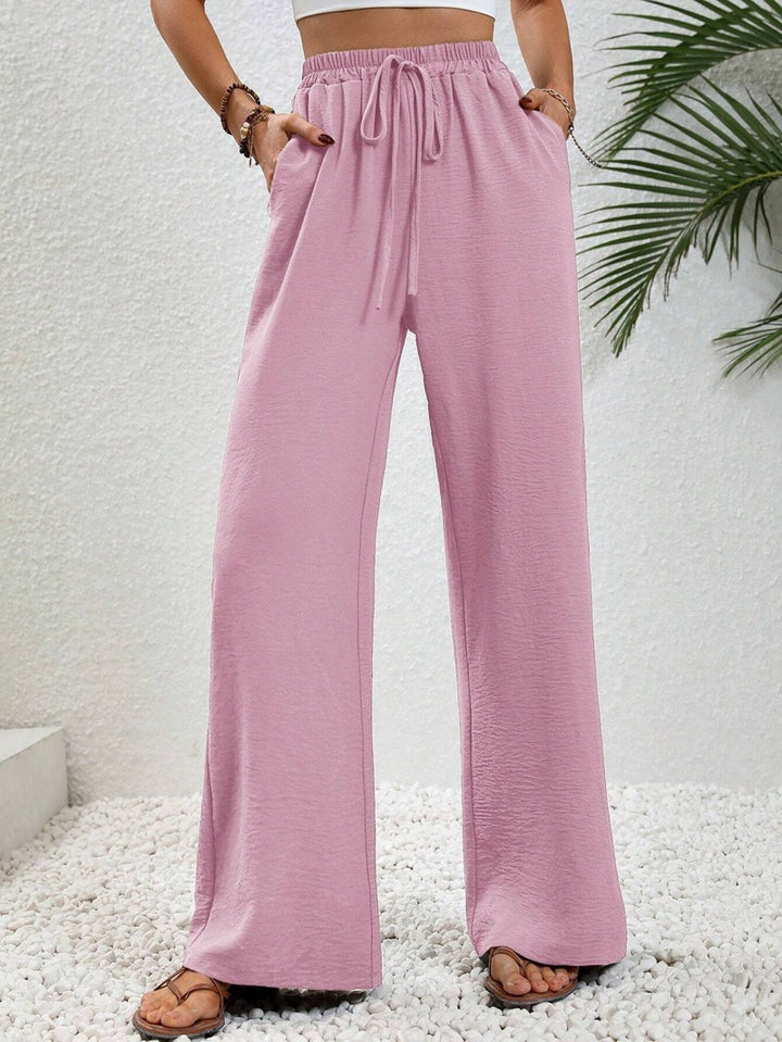 Ladies lightweight, loose-fitting beach pants with elastic waistband, drawstring and side pockets Mune Fashion