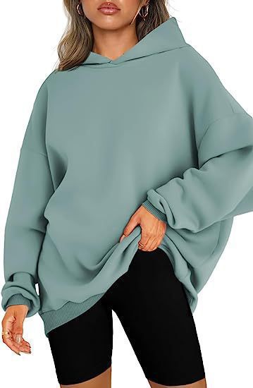 Women's oversized hoodie in longline cut with raglan sleeves and soft inner lining Mune Fashion