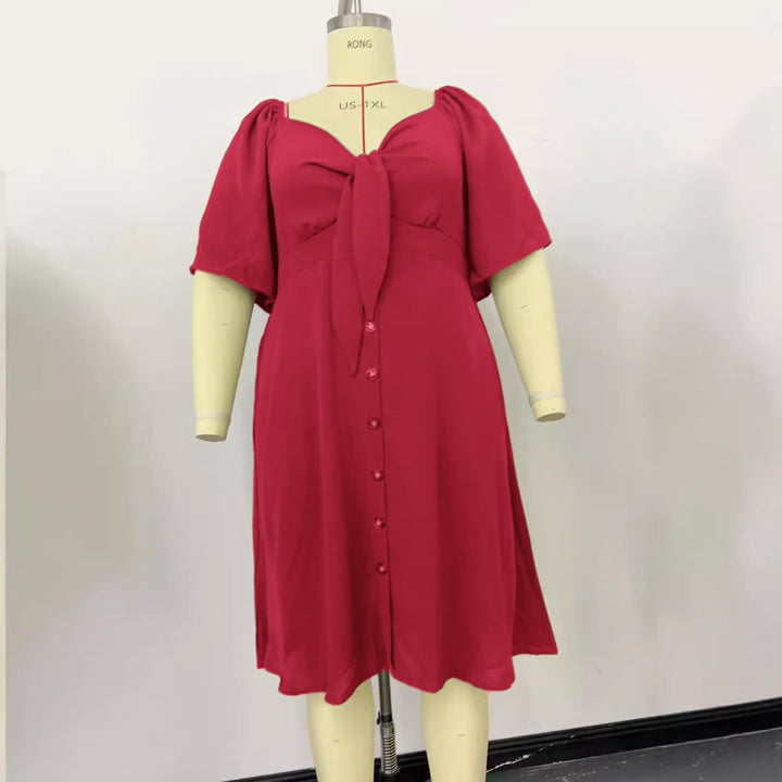 Women A-line midi dress with knot detail, puff sleeves and button placket Mune Fashion
