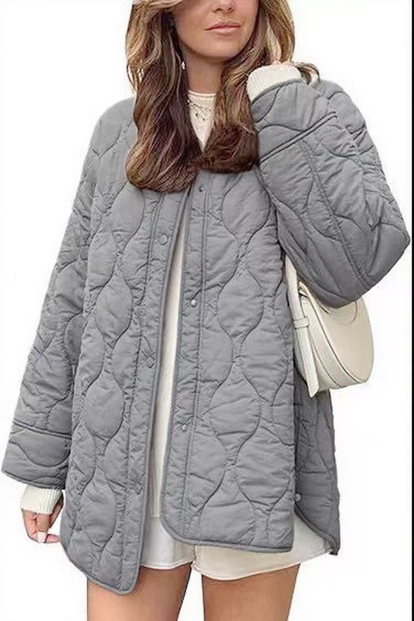 Women's quilted jacket in oversized design with curved quilting and side slit Mune Fashion