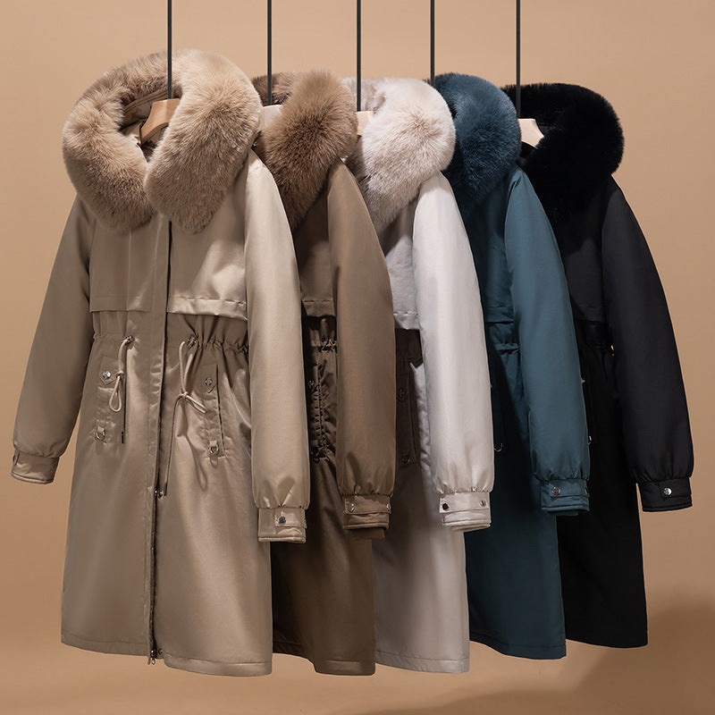 Women's longer water-repellent parka with voluminous faux fur hood, adjustable drawstring waist, and quilted thermal inner jacket Mune Fashion