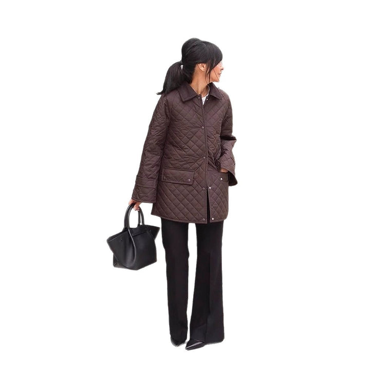 Women's oversized quilted jacket in coat style with snap button placket and patch flap pockets Mune Fashion