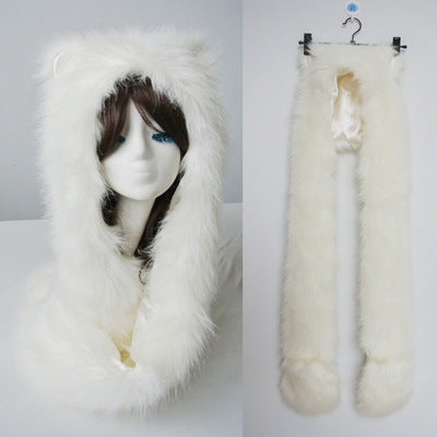 Ladies hooded stole made of luxurious faux fur with long scarf tails and pompom ends Mune Fashion