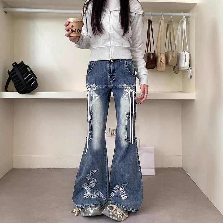 Women's wide flared cargo-style jeans with decorative ribbons, lace appliqués, and multiple pockets Mune Fashion