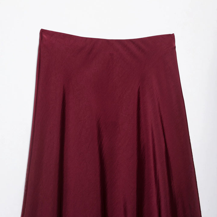Women's flowy midi skirt in satin look with high waistband and asymmetrical hem Mune Fashion