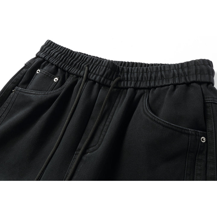 Women's wide high-waisted jeans with elastic waistband, drawstring, and decorative seams Mune Fashion