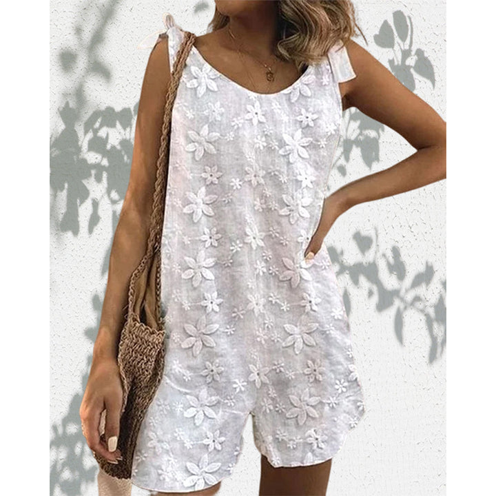 Women's lighter short overall with floral three-dimensional embroidery, adjustable tie straps and loose A-line silhouette Mune Fashion