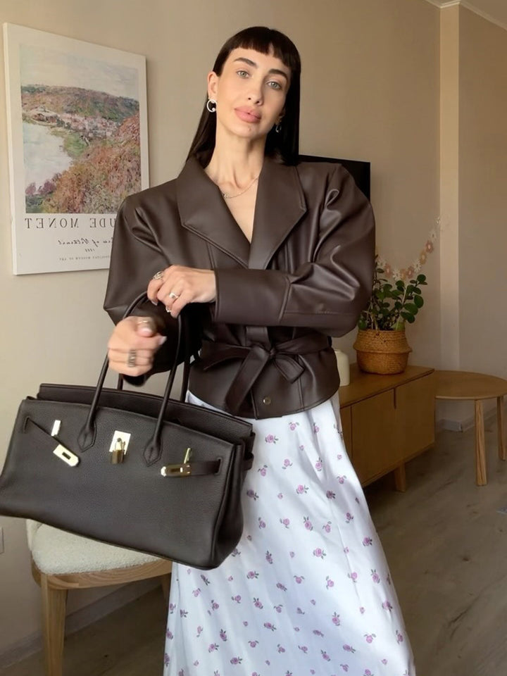 Women’s short blazer made of vegan leather with waist belt Mune Fashion