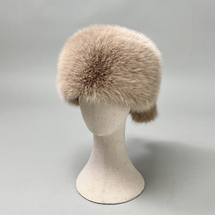 Women’s plush faux fur trapper hat with earflaps and decorative tail Mune Fashion
