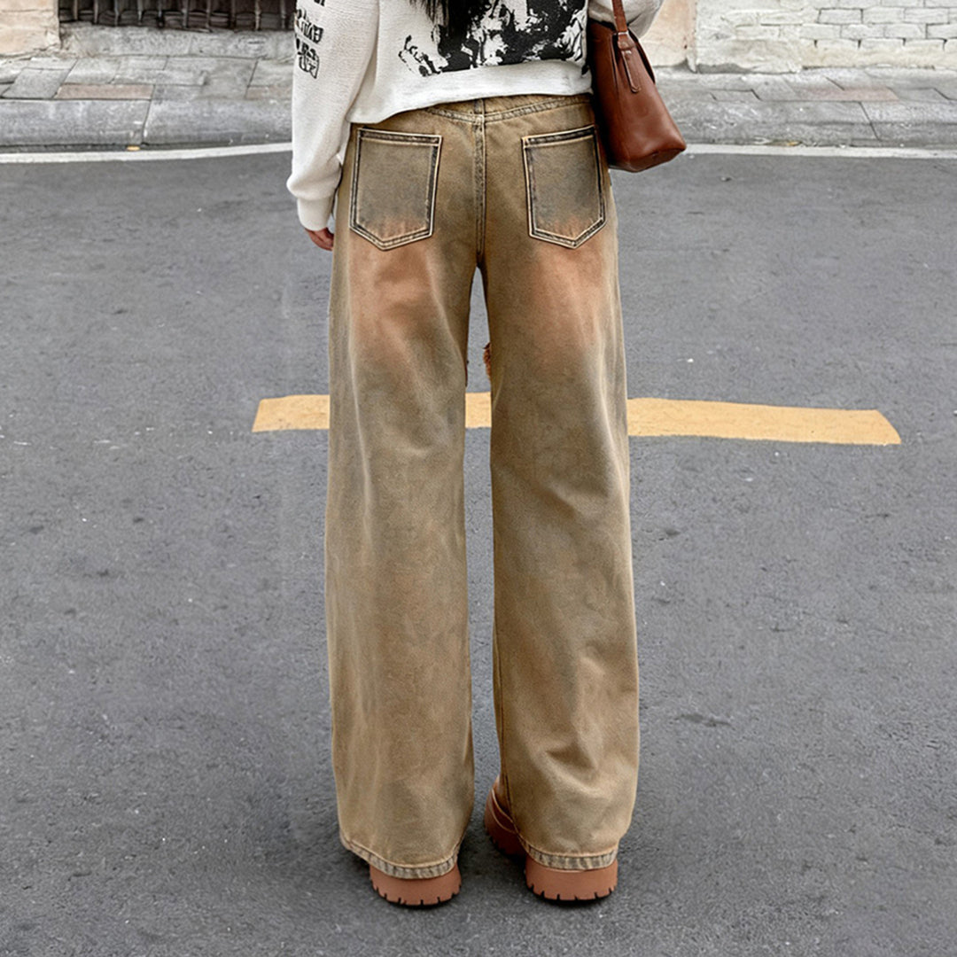 Women's high-waisted wide-leg jeans with raw hem seams, diagonal fringe trim, and relaxed fit Mune Fashion