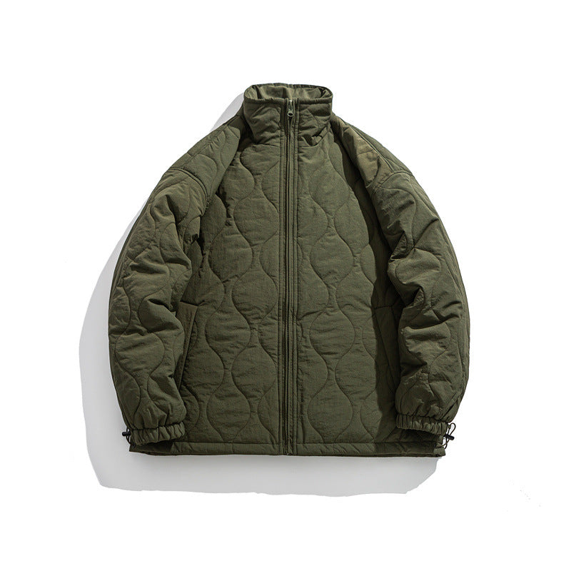 Unisex Boxy quilted jacket in military liner style with high stand-up collar and adjustable hem Mune Fashion