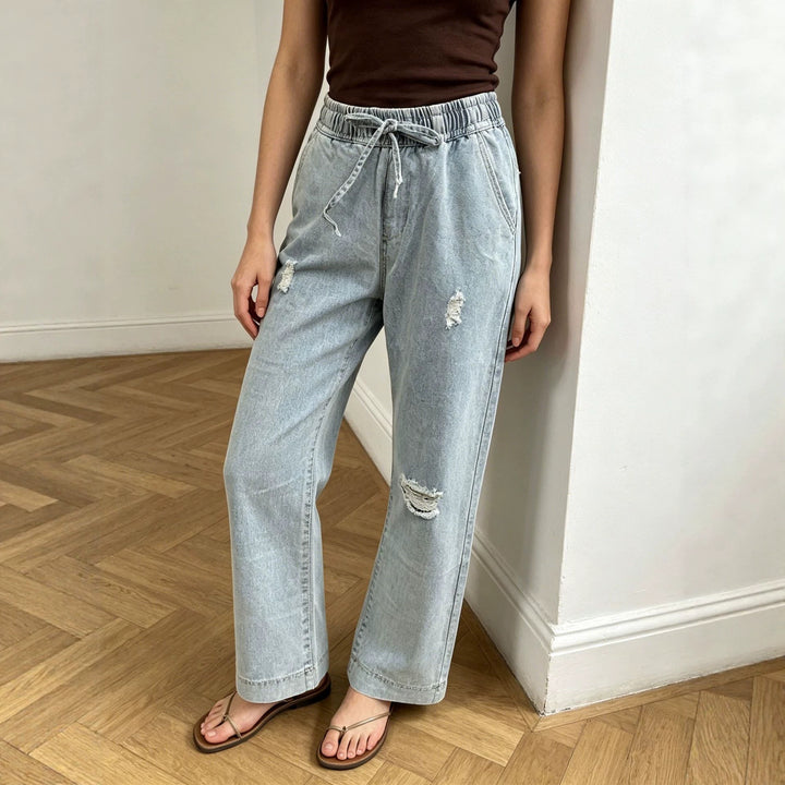 Women's wide denim pants with elastic drawstring waistband, used effects and relaxed fit Mune Fashion