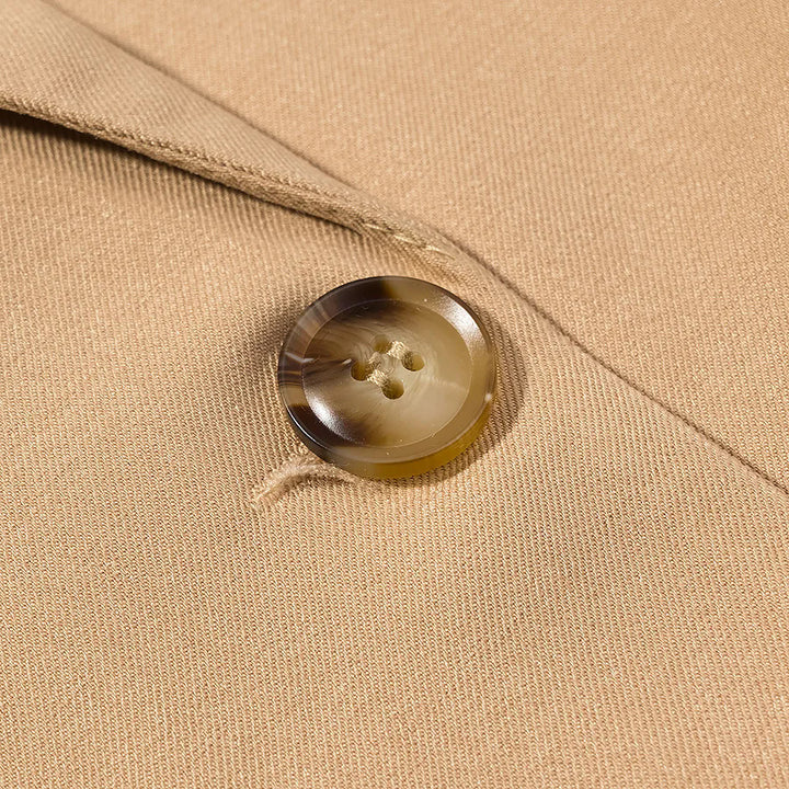 Women's longer tailored wool blend coat with lapel collar, patch pockets, and full button placket Mune Fashion
