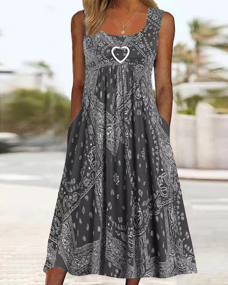 Women's airy maxi dress with paisley bandana print, gathered empire waist and practical side pockets Mune Fashion