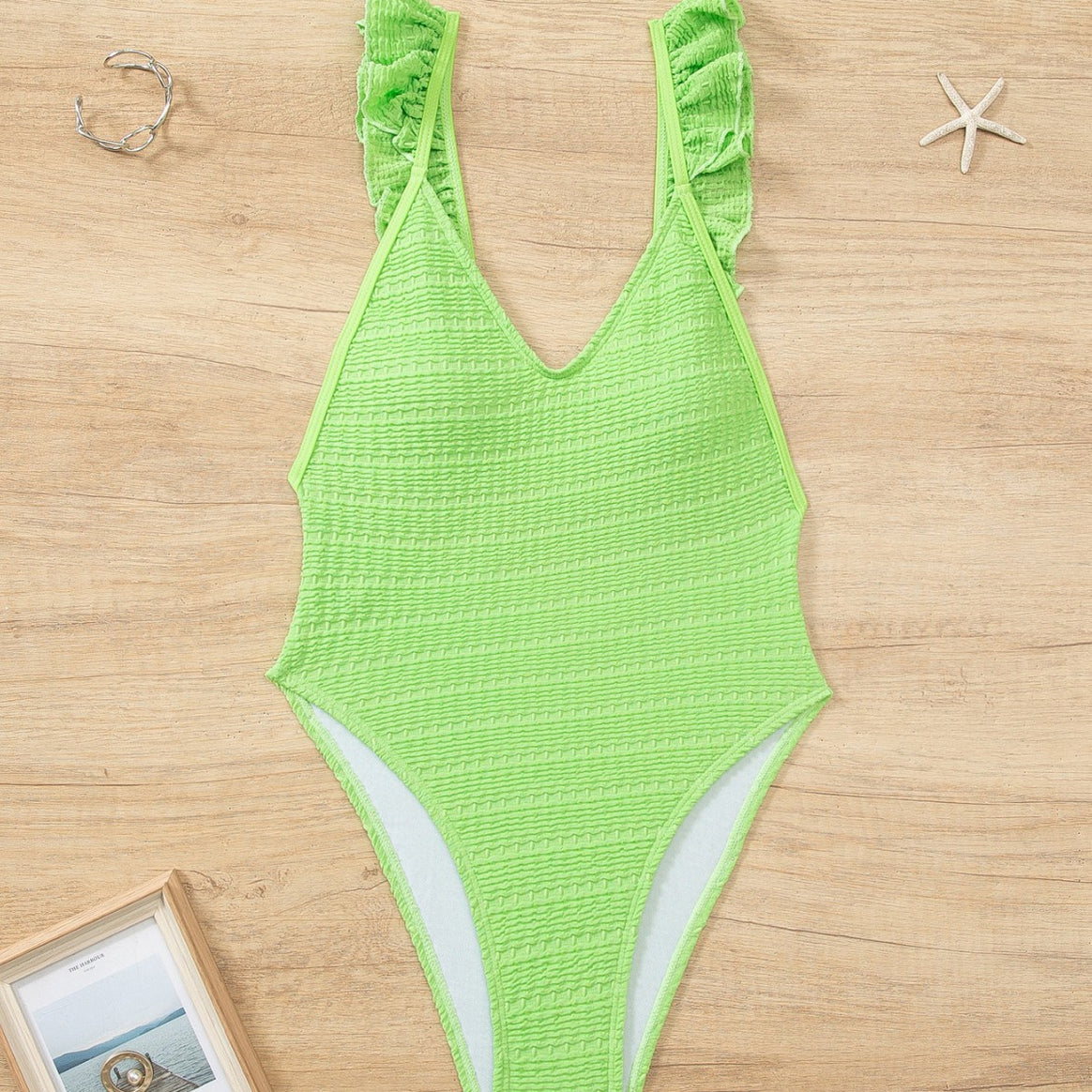 Ladies' one-piece swimsuit with ruffle details and high leg cut Mune Fashion