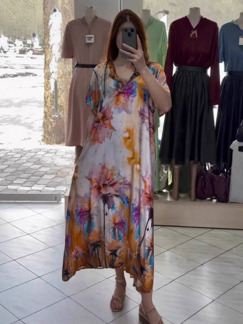 Women flowing maxi kaftan dress with V-neck and large watercolor floral print Mune Fashion