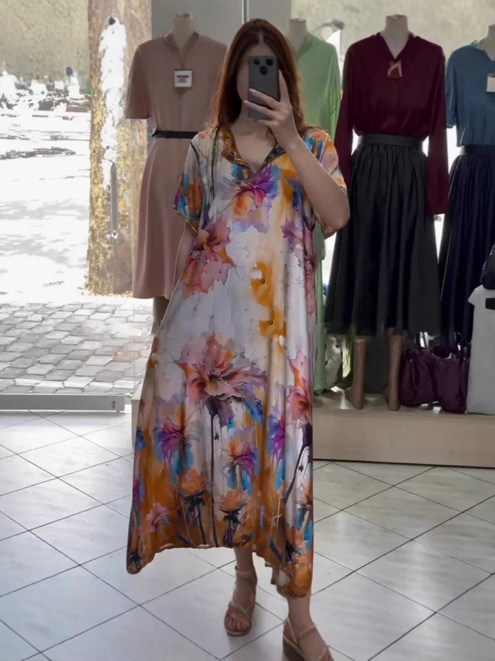 Women flowing maxi kaftan dress with V-neck and large watercolor floral print Mune Fashion