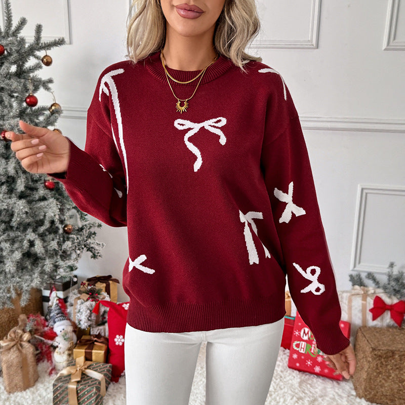Ladies fine jacquard knit pullover with bow motif, round neckline and ribbed hem