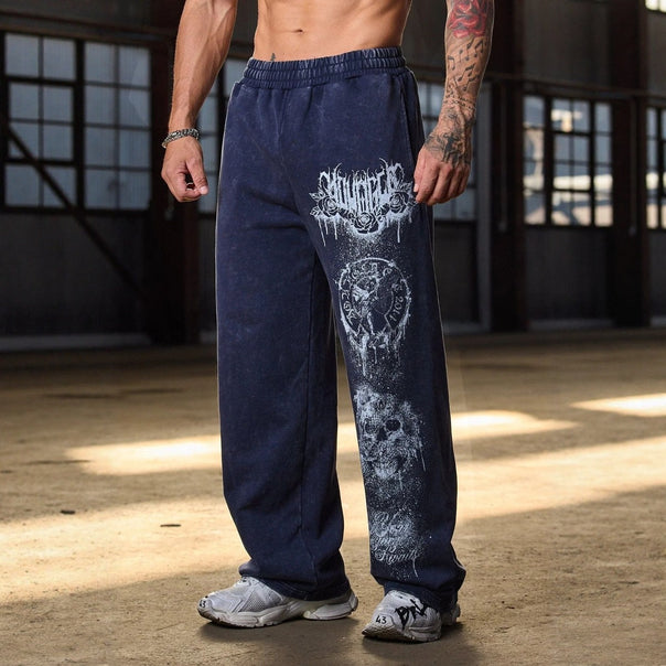 Men's baggy joggers with elastic waistband, side pockets and detailed skull and rose motif Mune Fashion